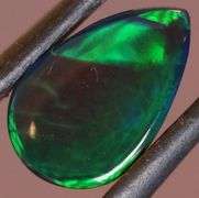 Magnificent 2.40ct teal and green flashing Black Opal