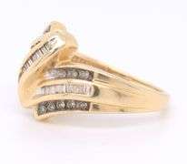 Beautiful Round Brilliant Cut and Baguette Diamond Ring in Yellow Gold
