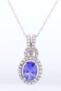 Attractive White Gold Tanzanite and Diamond Halo Pendant on Chain