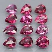 Premium pear cut 7.52ct VS Rhodolite Garnet set