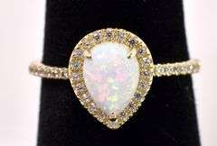 Gleaming Opal And Diamond Ring In Yellow Gold