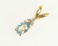 14K Yellow Gold Oval Blue Topaz Diamond Cluster Accent Pendant