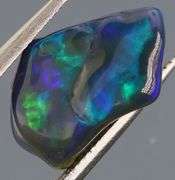 High fire collectors 2.25ct free form black Opal vein