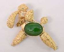 Adventurous Poodle Pin With Diamond and Green Gemstone In 18K Yellow Gold