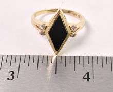 Magnificent Black Onyx and Diamond Ring In Yellow Gold