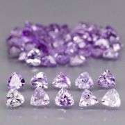 Heavy flashing 4.88ct trillion cut Tanzanite set