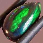 Magnificent 2.40ct teal and green flashing Black Opal
