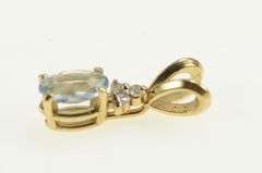 14K Yellow Gold Oval Blue Topaz Diamond Cluster Accent Pendant