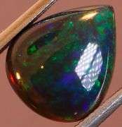 Magnificent 2.15ct blue and green flashing Black Opal