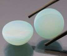 Glowing 17.00ct blue Chalcedony cabochon pair