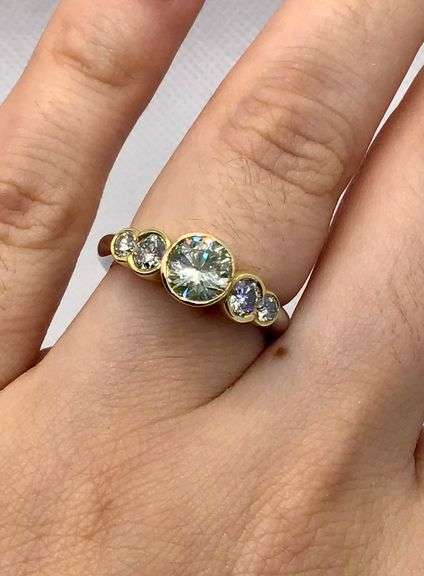 BREATHTAKING PLATINUM AND 18K YELLOW GOLD BEZEL SET DIAMOND RING