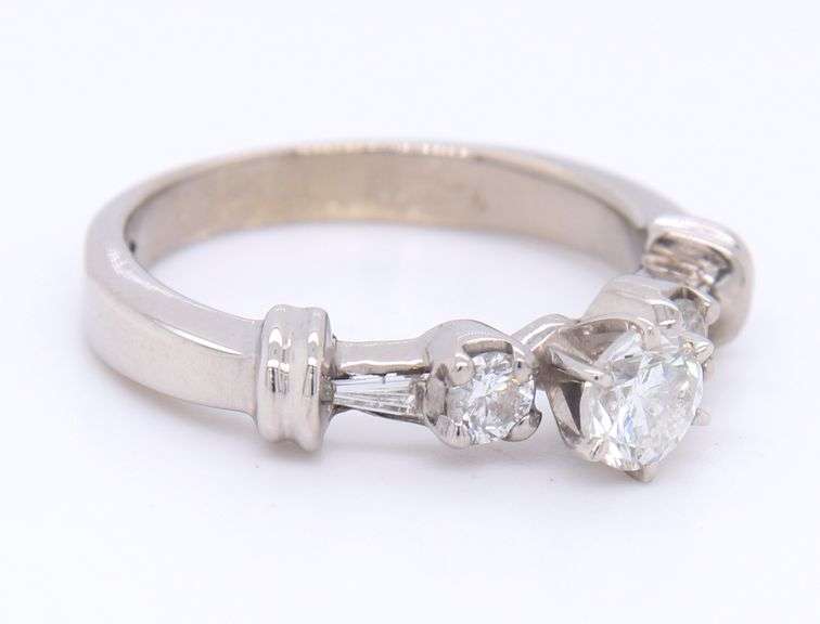 Dazzling White Gold Round Brilliant Cut and Tapered Baguette Three Stone Diamond Ring