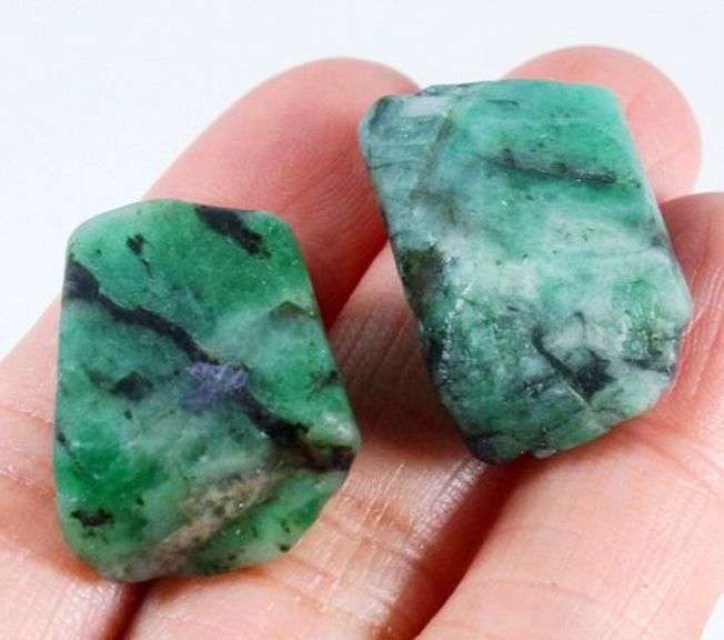 Collectors 64.30ct raw Emerald pair in matrix