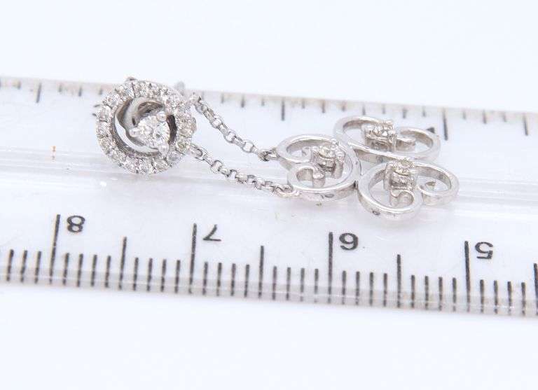 Sparkling White Gold Diamond Swirl Dangle Earrings