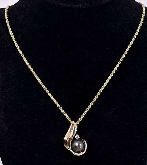 Endearing Pearl and Diamond Pendant Necklace In 14K Yellow Gold