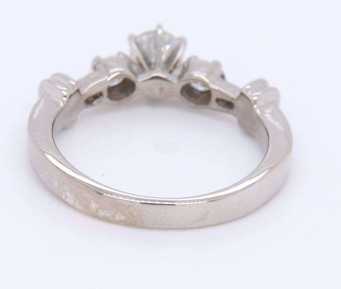 Dazzling White Gold Round Brilliant Cut and Tapered Baguette Three Stone Diamond Ring