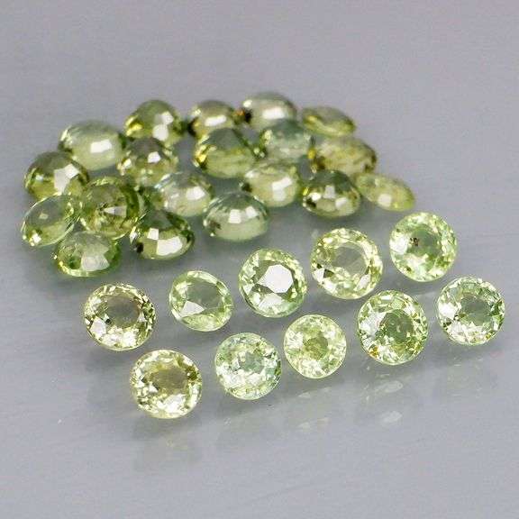 Fantastic 6.15ct diamond cut GREEN Sapphire set