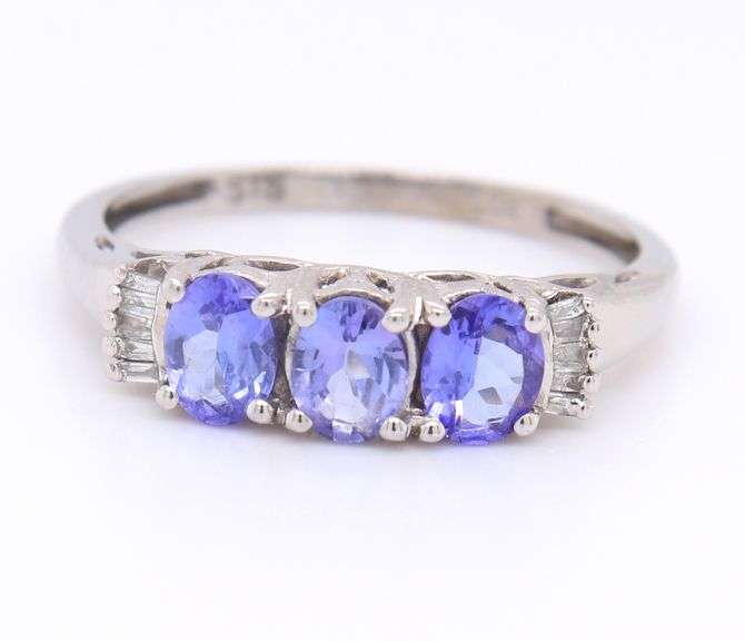 Gorgeous White Gold Oval Tanzanite and Baguette Three Stone Ring