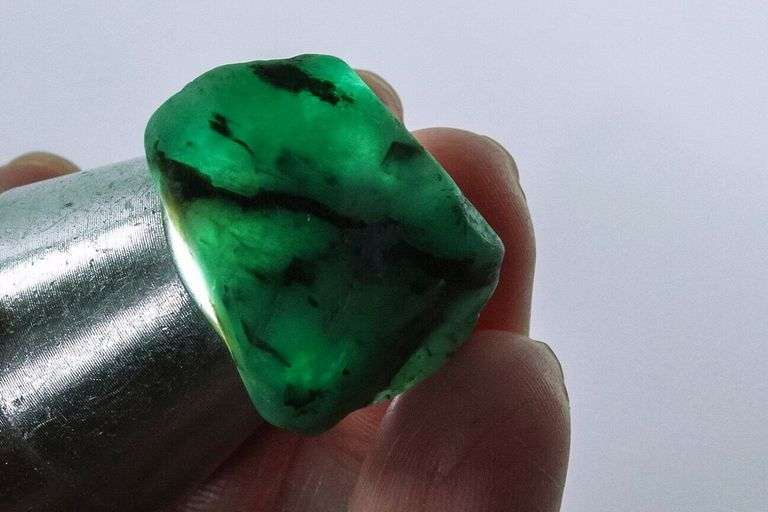 Collectors 64.30ct raw Emerald pair in matrix