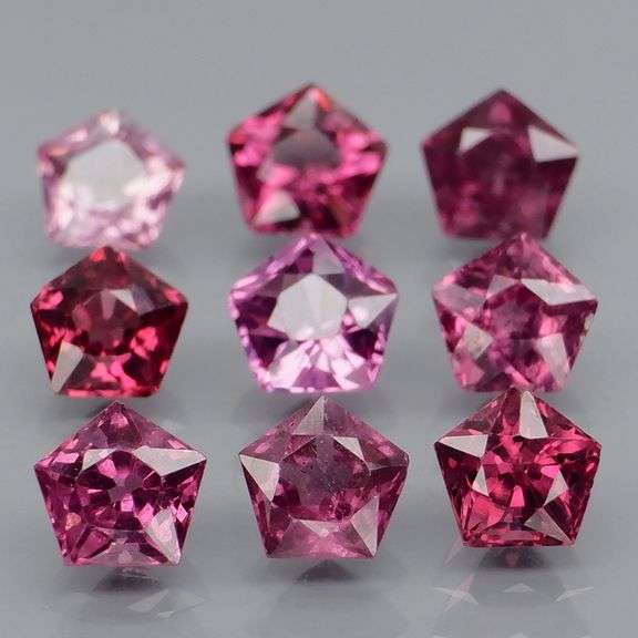 Ravishing 4.57ct violet pink star cut Rhodolite Garnet set