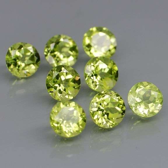 Dazzling 4.56ct top apple green Peridot set