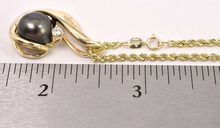Endearing Pearl and Diamond Pendant Necklace In 14K Yellow Gold