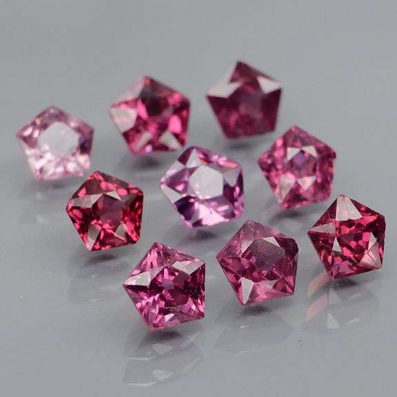 Ravishing 4.57ct violet pink star cut Rhodolite Garnet set