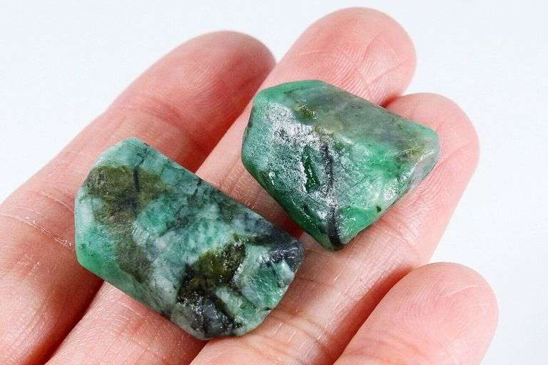 Collectors 64.30ct raw Emerald pair in matrix