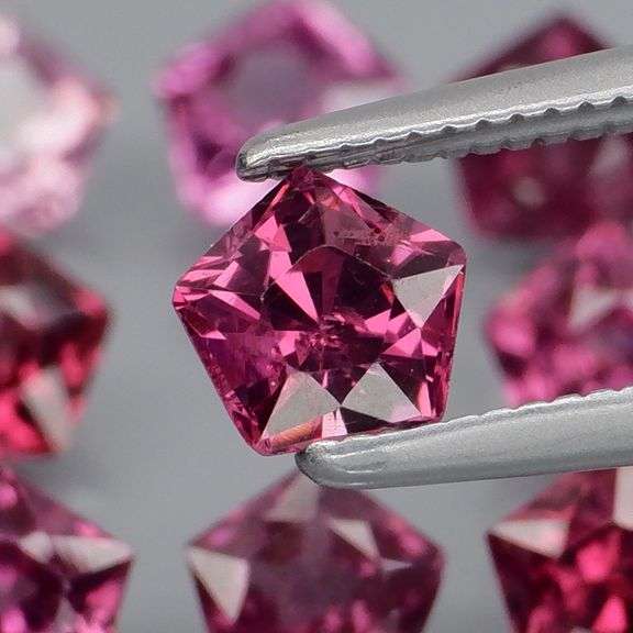 Ravishing 4.57ct violet pink star cut Rhodolite Garnet set