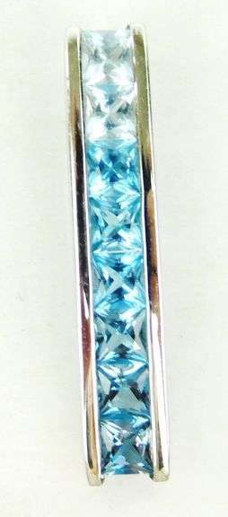 10K Pendant of Princess Cut Blue Topaz Stones