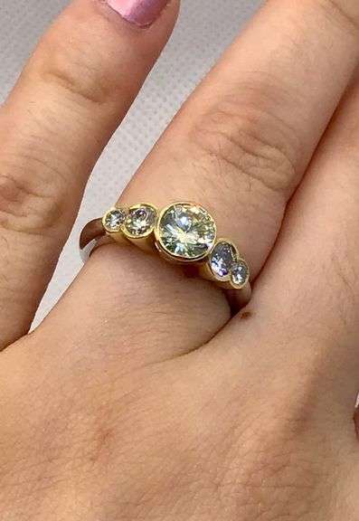 BREATHTAKING PLATINUM AND 18K YELLOW GOLD BEZEL SET DIAMOND RING