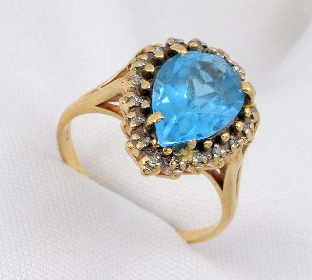 Pear Sha[ed Blue Topaz Ring with Diamonds