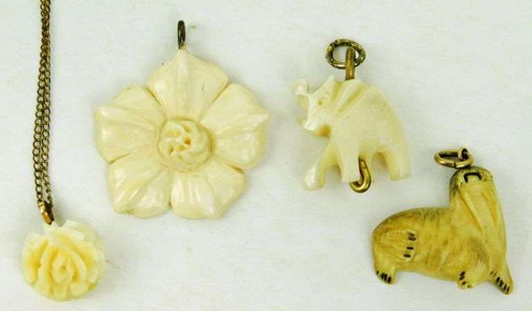 4 Vintage Carved Bone Pendants