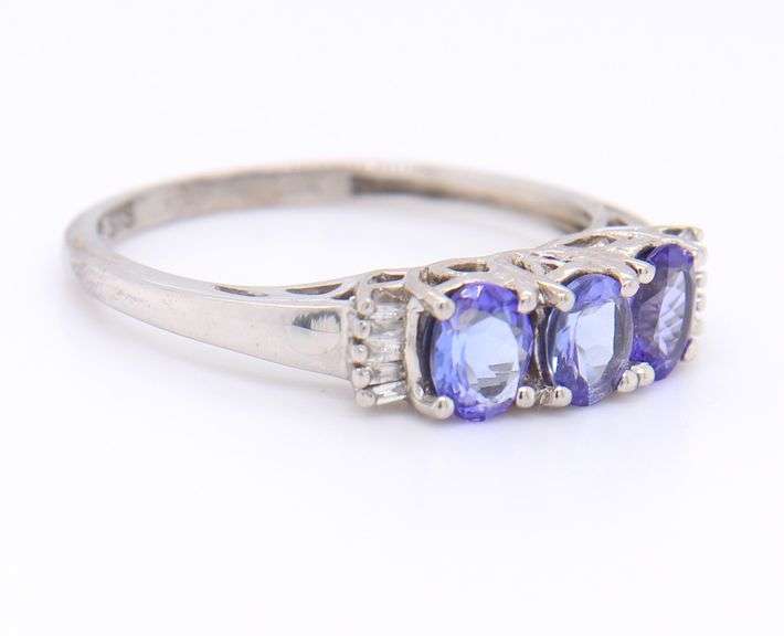 Gorgeous White Gold Oval Tanzanite and Baguette Three Stone Ring