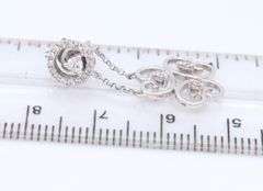 Sparkling White Gold Diamond Swirl Dangle Earrings
