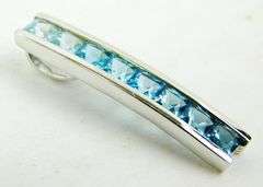 10K Pendant of Princess Cut Blue Topaz Stones