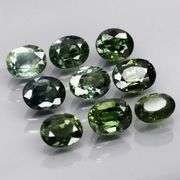 Heated only! 4.44ct blue green sapphire set