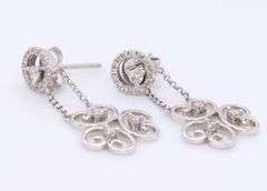 Sparkling White Gold Diamond Swirl Dangle Earrings