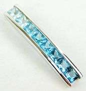 10K Pendant of Princess Cut Blue Topaz Stones