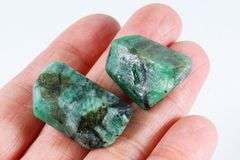 Collectors 64.30ct raw Emerald pair in matrix