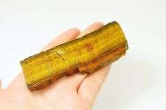 Mezmerizing 303ct rough cut Tiger Eye