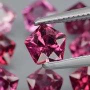Ravishing 4.57ct violet pink star cut Rhodolite Garnet set