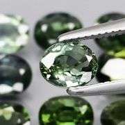Heated only! 4.44ct blue green sapphire set