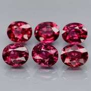 Amazing 4.84ct oval cut reddish pink Garnet set