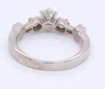 Dazzling White Gold Round Brilliant Cut and Tapered Baguette Three Stone Diamond Ring