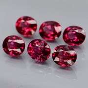 Amazing 4.84ct oval cut reddish pink Garnet set