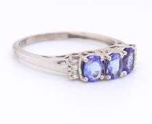 Gorgeous White Gold Oval Tanzanite and Baguette Three Stone Ring