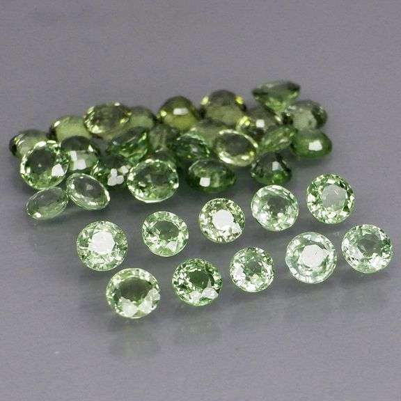 Awesome 6.96ct diamond cut GREEN Sapphire set