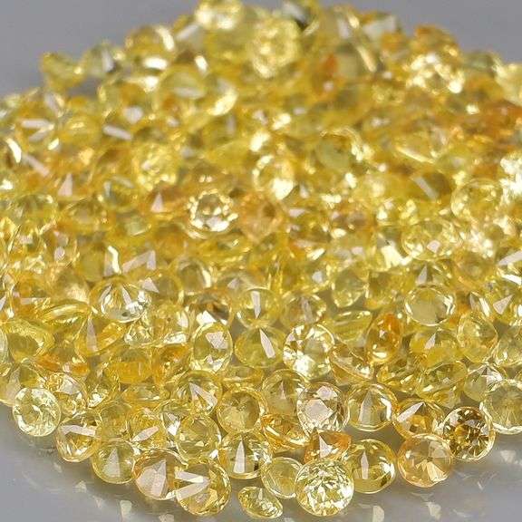 Fantastic 5.43ct diamond cut yellow Sapphire set