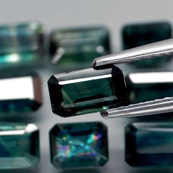 Heated only! 5.80ct blue green Sapphire set